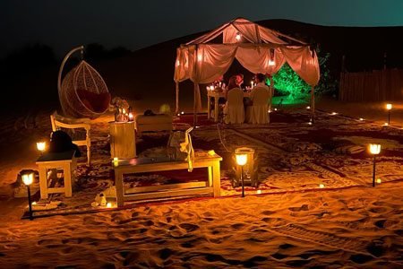 People are enjoying dinner in desert